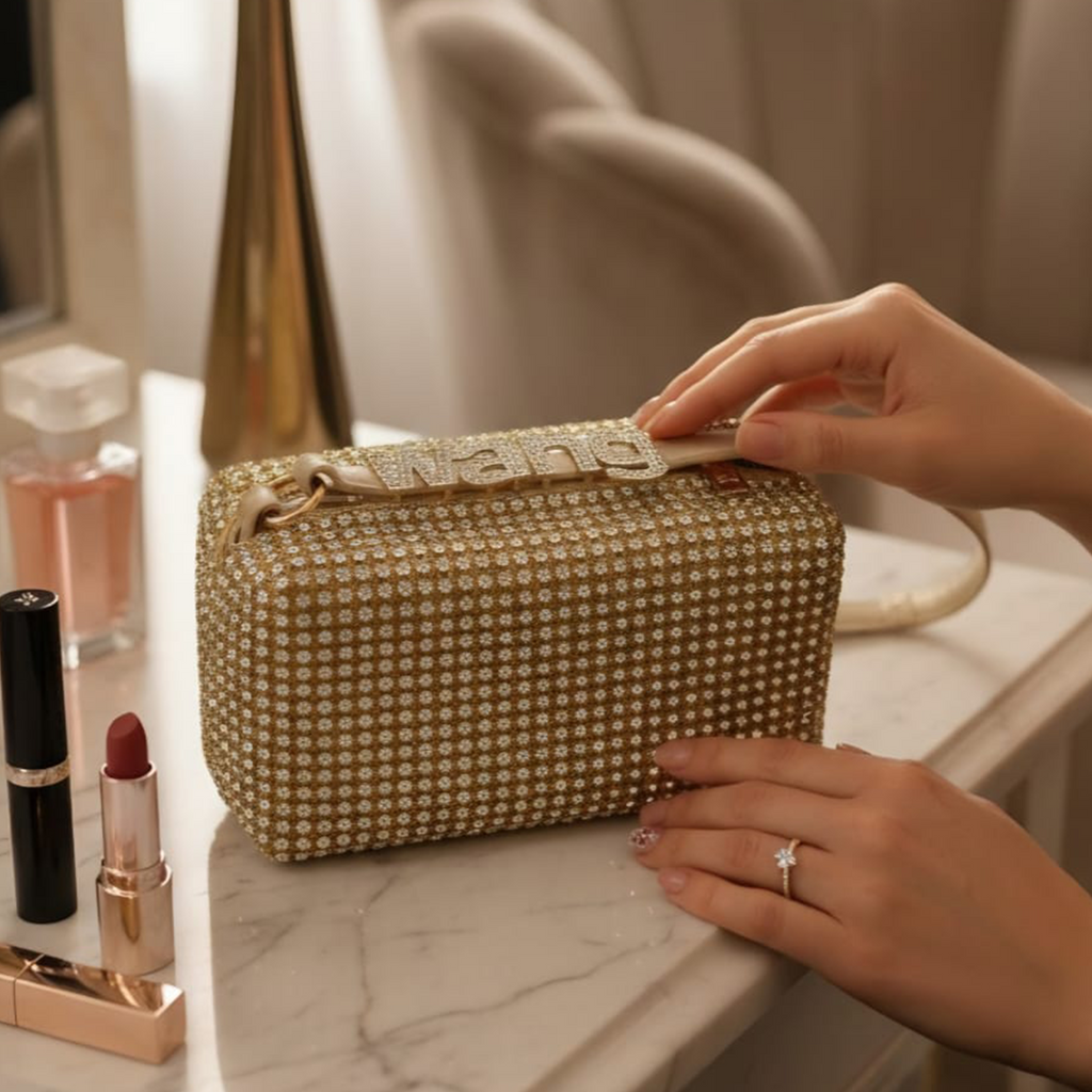 Alexander Wang crystal rhinestone box bag gold on marble vanity with makeup
